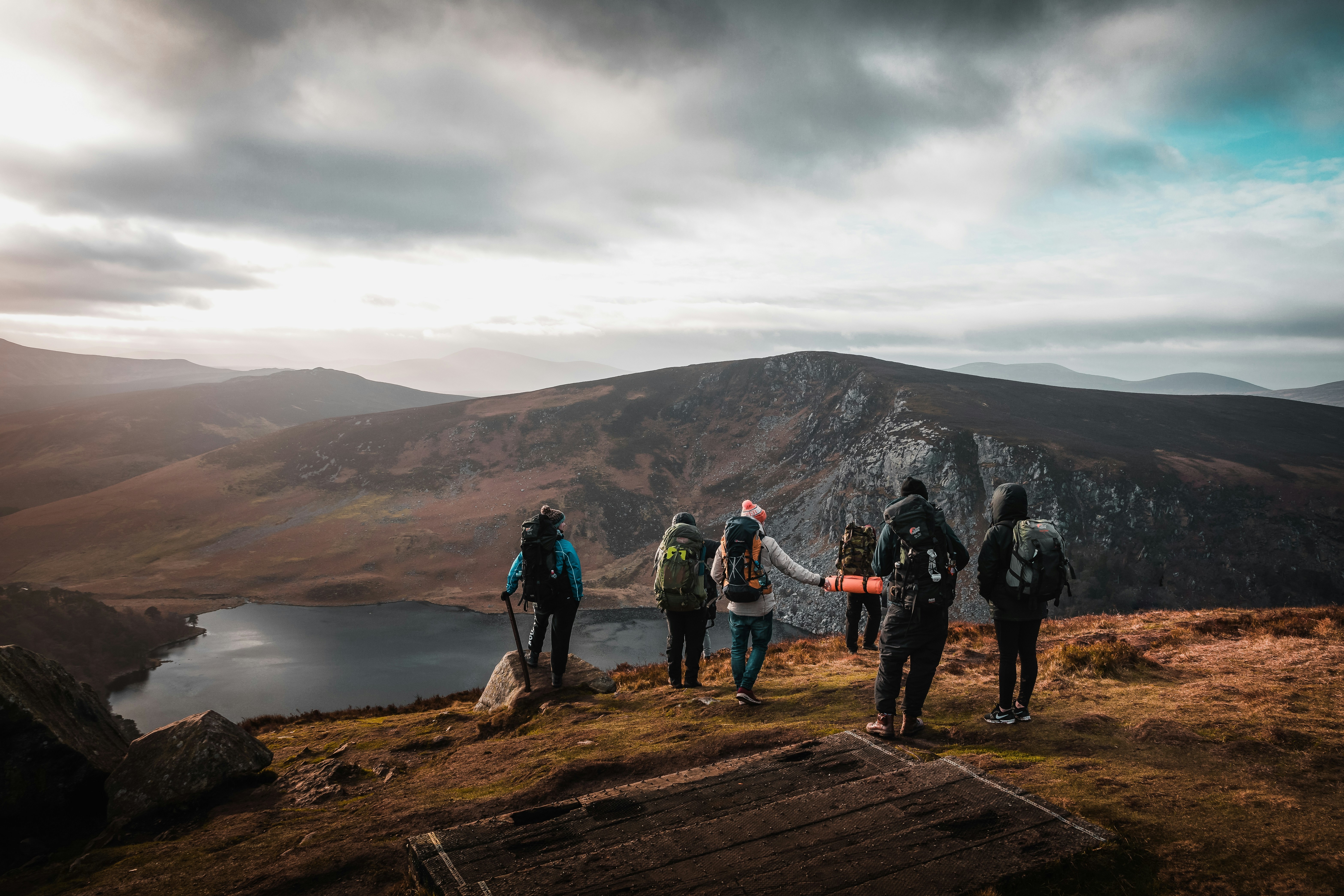 group of people are hiking on the mountains